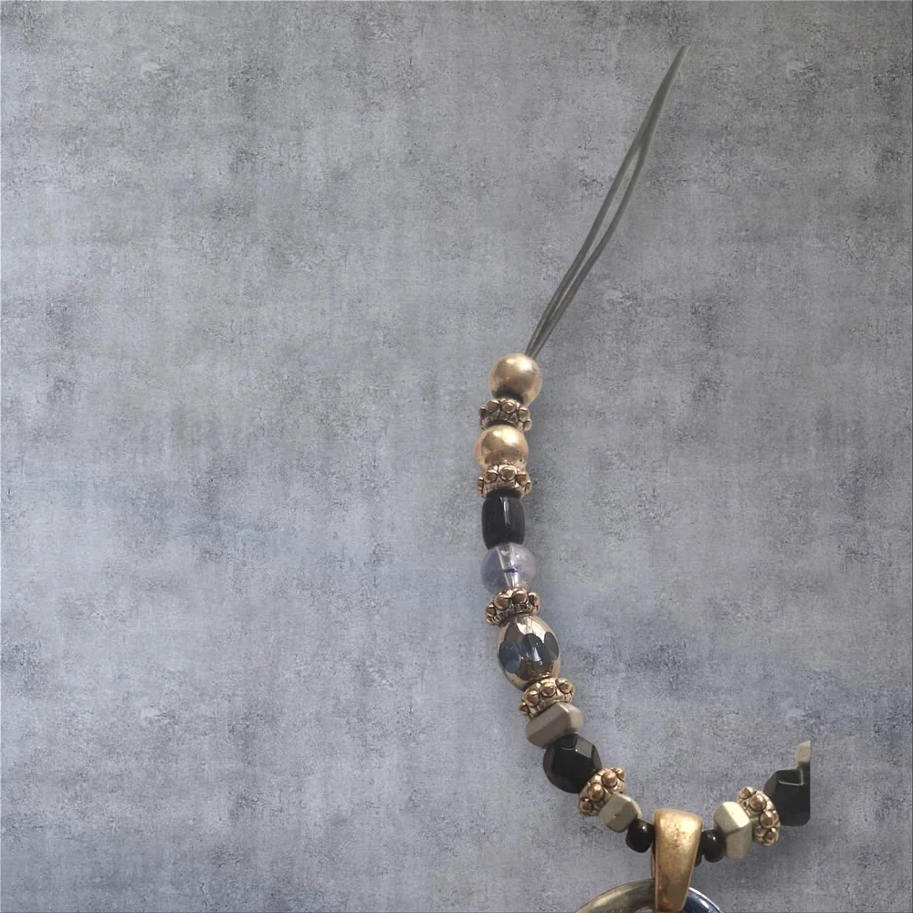 Gold Silver Black and Blur Necklace with Striking Pendant